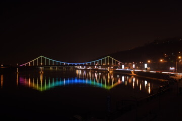 Fototapeta na wymiar Night pedestnrian bridge with incredible lighting