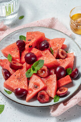A fresh fruit salad made from cherries and watermelon
