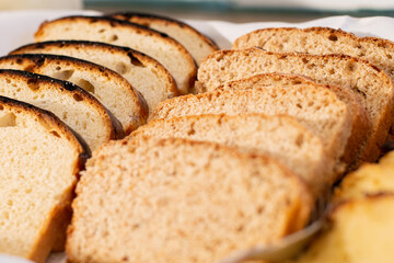 Breakfast served with breads, jams, fruits, cold cuts, cheese, ham, scrambled eggs, cakes and pies
