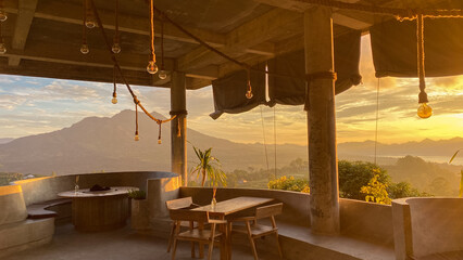 Empty cafe on sunrise with view on Batur volcano