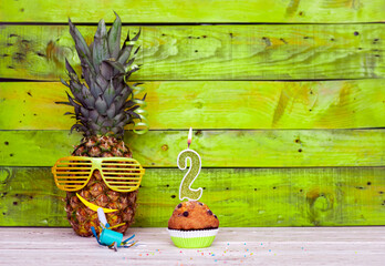 Creative card postcard happy birthday with number  2. Background character pineapple in festive...