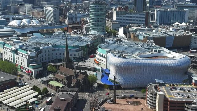 View of the skyline of Birmingham, UK including The church of St Martin, the Bullring shopping centre and the outdoor market.
