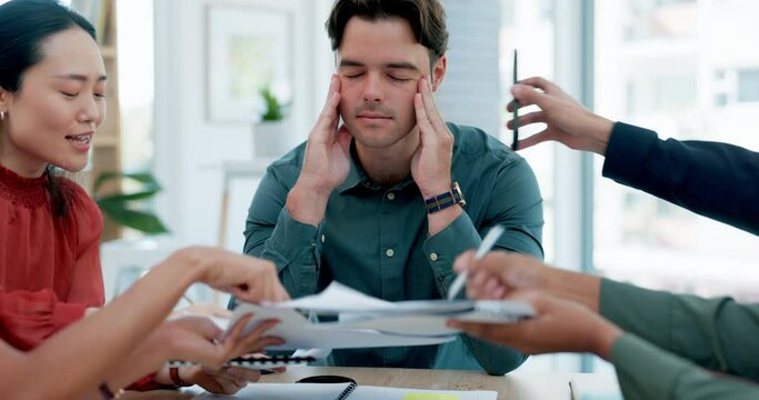 Headache, stress and business man in office with chaos, frustration and overwhelmed with team, report or deadline. Migraine, anxiety and guy manager with group documents for tax, audit or compliance