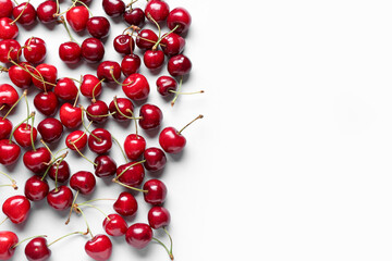 Many sweet cherries on blue background