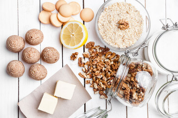 Traditional bee nest cake and ingredients on wooden background