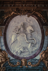 King Louis also called the sun king carved riding a horse and defeating his rivals