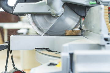 Closeup circular woodworking sawmill cutting wooden board. High quality photo