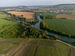 Panoramic aerial view on green premier cru champagne vineyards and fields near village Hautvillers...