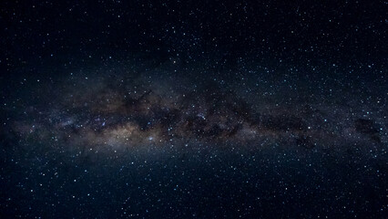 The Milky Way Galaxy moving over the mountain ridge. Night lapse from night to day. Starry night.