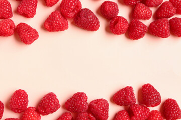 Many fresh raspberries on pink background