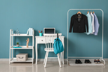 Stylish interior of modern children's room with school uniform and shoes
