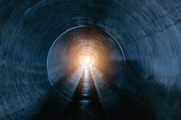 Indide dark round underground sewer tunnel - obrazy, fototapety, plakaty