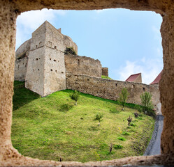 Fototapeta na wymiar View of Rupea fortress in Brasov county, Romania - from a tower window. Medieval saxon landmark of Transylvania.