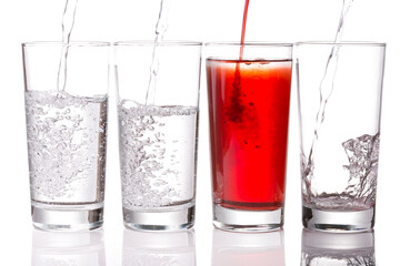 Pouring Squash and Water into Glasses