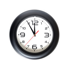 Big round wall clock with a black rim isolated on yellow background close-up and arrows showing almost twelve o'clock