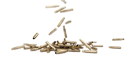 Falling Bullet Shells Isolated On White