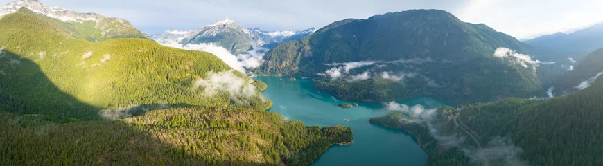 Gordijnen Rugged, forest-covered landscape surrounds Diablo Lake in North Cascades National Park. This mountainous region of northern Washington is absolutely beautiful and easily accessed during summer months. © ead72