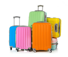 Multi-colored suitcases isolated on white