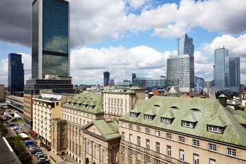 Fototapeta na wymiar Old residences and modern office buildings at Warsaw city center.