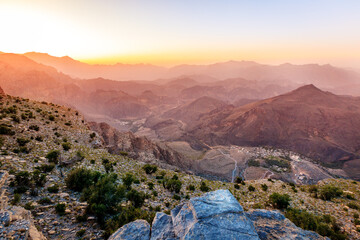 Scenic view of Al Hajar mountains in the Sultanate of Oman at sunset - obrazy, fototapety, plakaty