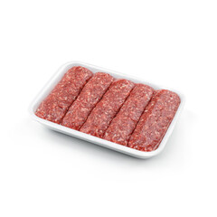 Raw meat sausages in caserola isolated on white background. Meat food, top view