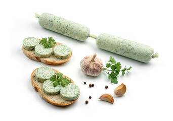 Stick of vegan sausage and sandwiches with pate, greens and spices isolated on white background. Meat sausage, top view