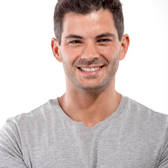 Obraz premium Portrait of a handsome latin man smiling, isolated over a white background