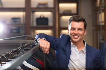 Smiling businessman in suit indoors