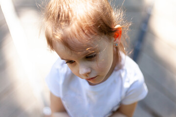 Portrait of a cute little girl in a white T-shirt