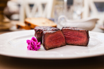 Filet mignon served on a plate in restaurant