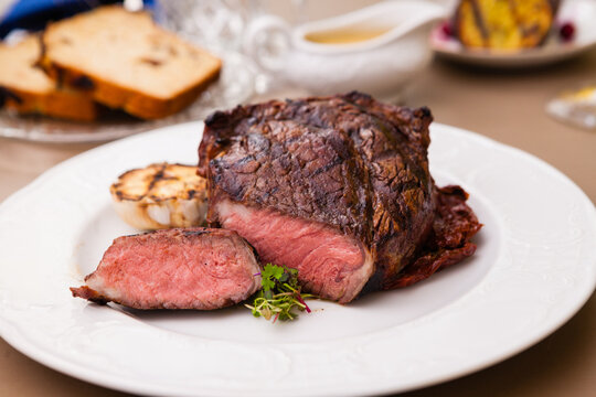 Entrecote with grilled garlic served on a plate