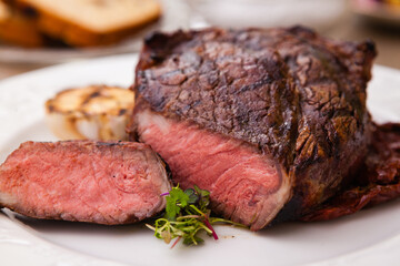 Entrecote with grilled garlic served on a plate