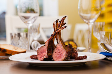 Lamb rack with limoncello glaze served on a plate © Designpics