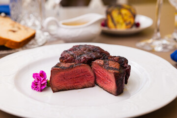 Filet mignon served on a plate in restaurant