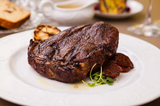 Entrecote with grilled garlic served on a plate