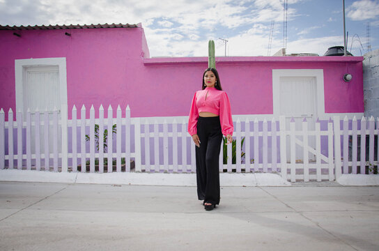 mexican girl in the street of the village, medium shot