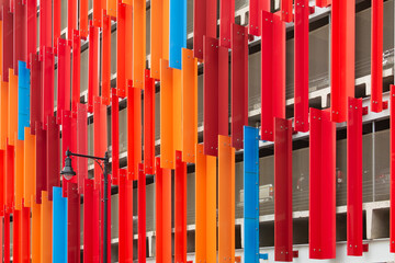 Multi colored vertical steel panels covering a parking garage exterior, Brighton, USA