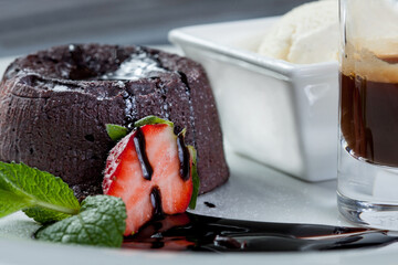 beautiful chocolate dessert with cake and berry