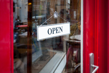 An image of an open sign at the shop door