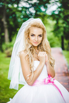 Elegant bride posing outdoors on a wedding day