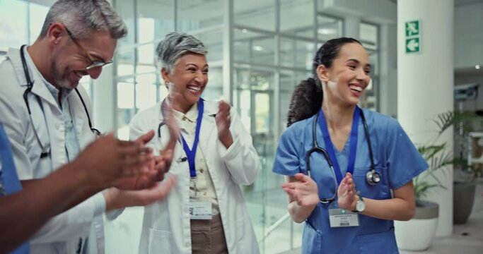 Clapping, celebrate and team of doctors in hospital cheering for a surgery success or goal. Happy, smile and group of professional healthcare workers with applause for collaboration in medical clinic