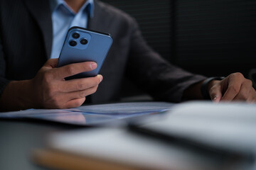 Young man surfing social media or texting messages on mobile phone. Communication, technology and lifestyle concept.