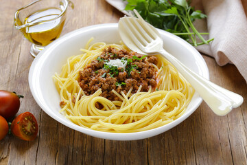traditional pasta with Bolognese sauce with parmesan and herbs
