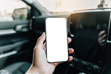 Hand holding smartphone blank screen on a car.