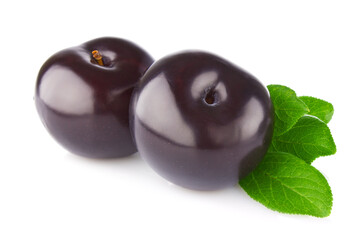 Fresh juicy organic plum with green leaf, isolated on white background