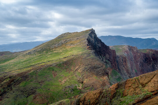 Mountain landscape of Madeira east coast. Famous hiking path through the fields and hills of volcanic tail of the island. Madeira, Portugal.