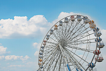 Ferris wheel on a clear day, wide angle view