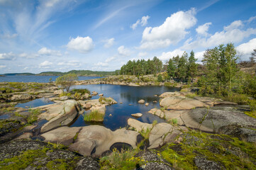 Fototapeta na wymiar Beautiful rocky shores of Ladoga lake islands, Karelia republic, Russia.
