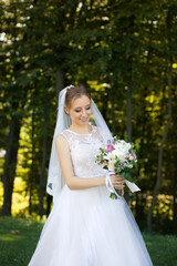 Close up of big bunch of fresh white roses and tulips flowers in female hands.