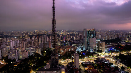 Fototapeta na wymiar Aerial view of Av. Paulista in Sao Paulo, SP. Main avenue of the capital. Photo at night, with car lights.